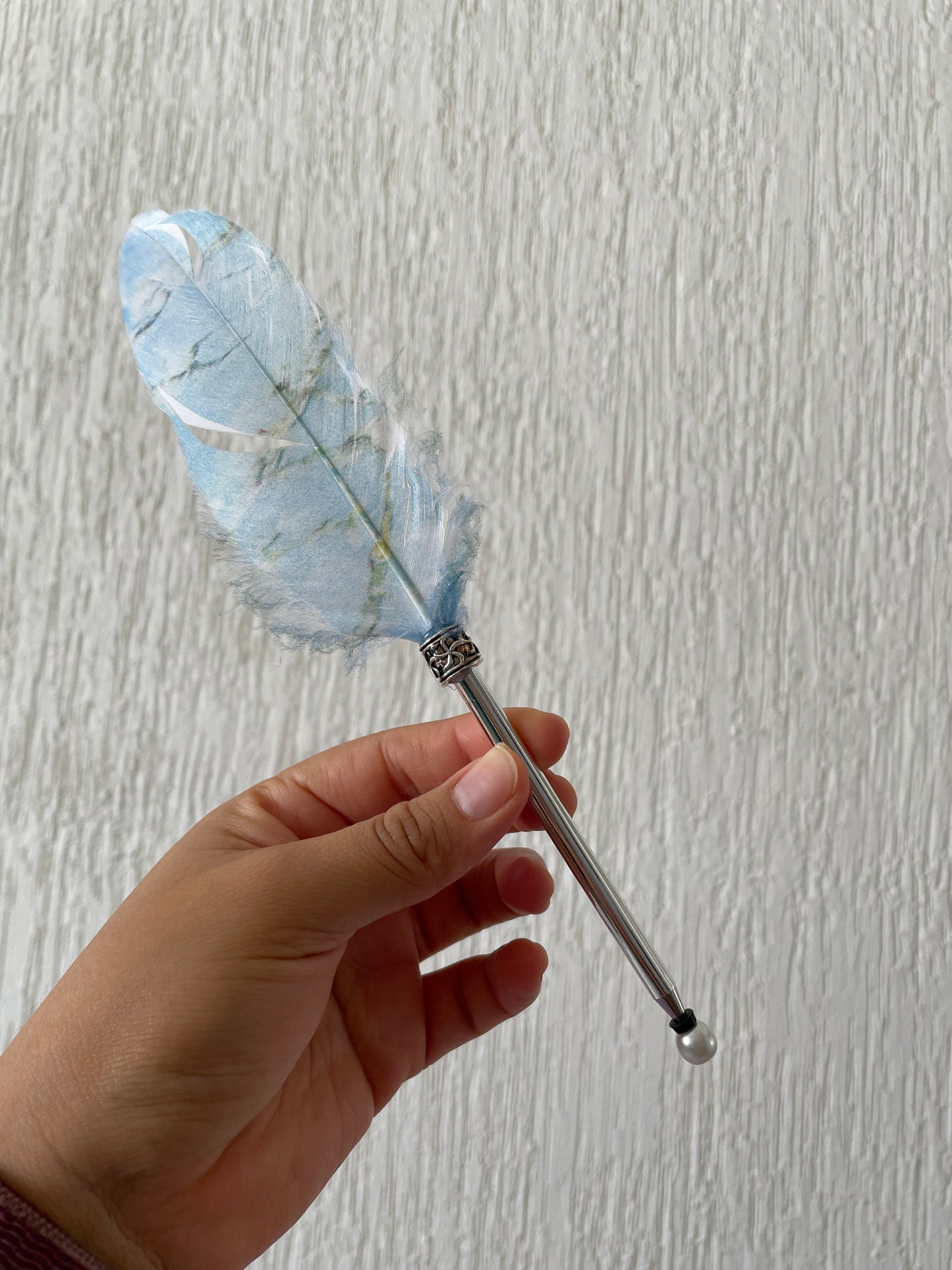 St. E. Pluma con pluma